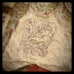 This is a pretty shirt w bird &plants on the front